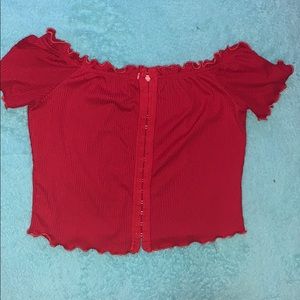 Red top with silver eye clips going up the top